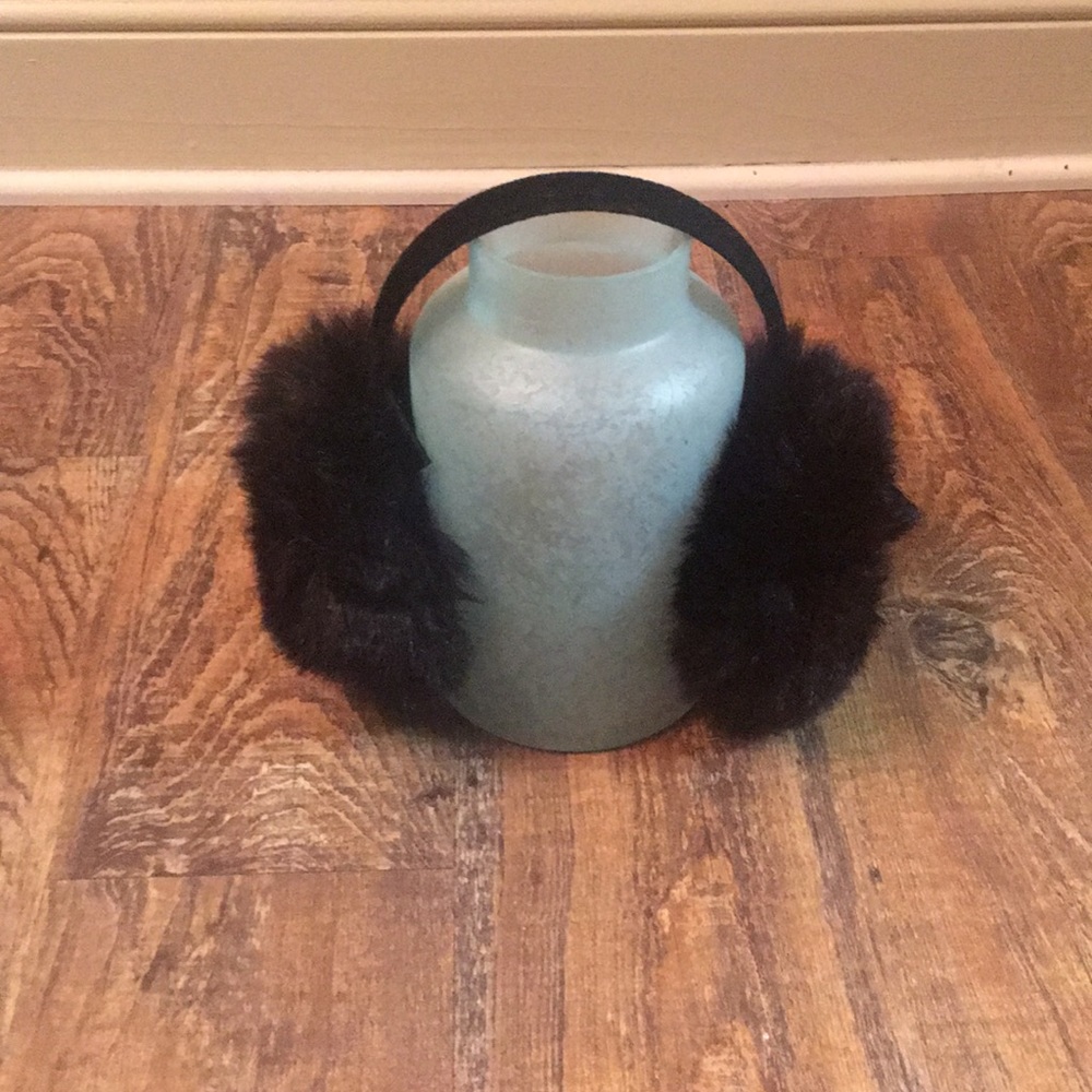 New black fuzzy earmuffs with velvet headband.